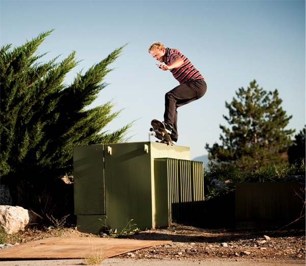 Jon Hart grinding a power box on a skateboard.