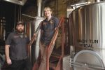 Jason Stock and Jenny Talley pose in the Squatters brewery. Photo: Katie Panzer