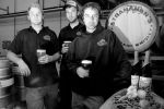 L-R: assistant brewer at RedRock and SLUG contributor Kyle Trammel, assistant brewer Isaac Winter and head brewer Kevin Templin pose with the ingredients used to create RedRock�s Paardebloem. Photo: Katie Panzer