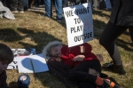 Many complete families attended with children holding signs, staying for the entire three hours or even longer. Photo: Garrett Allen Photography