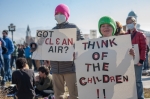 Children holding signs and exuberantly participating in the rally. Photo: Garrett Allen Photography