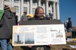 One adamant member holds a sign specifically calling forward Ira’s smoke stack. Photo: Garrett Allen Photography
