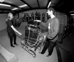 Shay McDowell and Taylor Gallegos hauling the speakers for the contest up the ramps in a rickety shopping cart. Photo: Matthew Windsor