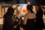 Artist Nikki Stoops pauses for a quick pose whilst talking to some interested onlookers.  Photo: Garrett Allen