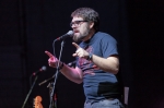 Poet RJ Walker has the crowd roaring with his witty banter and cultural references as he performs his work with much gusto.  Photo: Garrett Allen