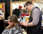 Barber Colton Lavery providing a fresh cut while representing Ray's Barbershop. Photo: www.matthewwindsorphoto.com