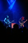 Eye's Set to Kill's Alexia (guitar) and Anissa (bass) rock in unison in matching fishnets. Photo: Garrett Allen