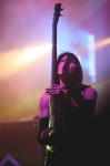 Bassist Emma Anzai rarely holds her bass in the traditional way.   Photo: Garrett Allen