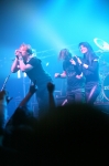 All three members of Sick Puppies take a bow for the crowd as they finish their set. Photo: Garrett Allen
