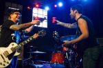 Versus the World give each other a cheers before they begin their set. Photo: Talyn Sherer