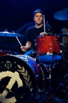 Drummer Bryan Charlson of Versus the World gets down on  Authority Zero's drumset. Photo: Talyn Sherer