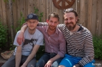 (L – R) Ben, Nick and Robert (the Easter Bunny) take a break. Robert plans to wear his smaller feet after stumbling around earlier in his bunny suit. “It’s time for smaller feet when the bunny’s been drinking,” he said. Photo by John Barkiple.