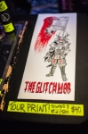 The Glitch Mob selling a tour only print featuring artwork for their touring album Love Death Immortality. Photo: Garrett Allen Photography