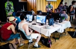 Halo 4 players viciously competing during the Gaming Cuisine Competitive League tournament. The GCCL also announced a name change to "The Hive Gaming League" during the con. Photo: Matt Brunk (unlifephotography.com)