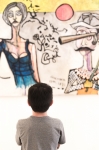A young boy admires the piece "blunderbuss" by artist Jeffrey Hale. Photo: Logan Sorenson / LmSorenson.net