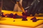 Beets are cut and stored before they are added to a kale salad. Photo: Talyn Sherer