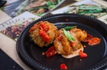 Brio Tuscan Grille provides black pepper shrimp & risotto balls stuffed with chorizo and fontina with a romesco sauce. Photo: Talyn Sherer