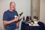 Dan Burick showcases the honey lavender ale being offered to art exhibit guests. Photo: Talyn Sherer