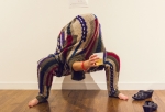 Ashley Howell tries on the piece from the "do it" exhibit with specific instructions on wearing a sweater the proper way. Photo: Talyn Sherer