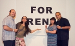(L-R) Dallas Barlow, Bonnie Barlow, Krin Reidel and SLUG beer reviewer Mike Reidel pose next to the For Rent sign hanging on display downstairs. Photo: Talyn Sherer