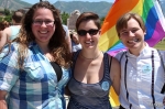 Ashley, Hannah and Selina love their friend, Courtney, who performed her slam poetry from the capitol steps. Photo by John Barkiple.