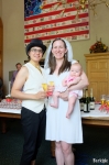 Davida and Molly with their daughter Ruby attend the Mayor’s reception for the 34 couples he married on December 20, 2013. “It’s really nice to meet him at this celebration after those quick marriages,” Molly said. “I’m thrilled to see him here,” Davida said. Photo by John Barkiple.