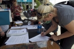 Registration for Summer of Death began at 1 p.m., and participants crowded the registration table to sign up for the contest. Photo: Robin Sessions