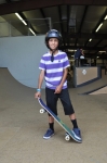 Colby Heinen stops his warm-up to pose with his skateboard. Photo: Robin Sessions