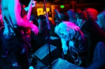 The front of the crowd, lined with leather clad females, thrashes to the energetic set. Photo: Garrett Allen