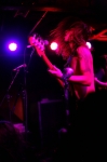 The hair thrashing Andrew Milne doesn’t miss a beat as he jumps around the stage. Photo: Garrett Allen