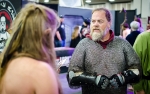 Hogar from the Society For Creative Anachronism explains the ins-and-outs of a modern medieval society with some fascinated con-goers. Photo: Matt Brunk