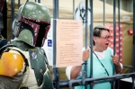 A bounty-hunter in Mandalorian armor poses with his latest catch - place bounties on your friends for charity at the Jail and Bail booth! Photo: Matt Brunk