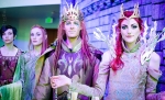 Elves posing for photos in front of Emberfire Castle, showing off costumes by Rachael Domingo Designs. Photo: Matt Brunk