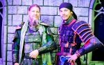 Juan and Q of The Society For Creative Anachronism posing in their armor in front of Emberfire Castle. Photo: Matt Brunk