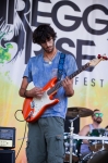Raphael Khan grooves on the guitar while performing with Tribe of I. Photo: Talyn Sherer