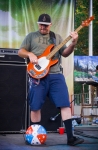 The Expendables bassist Ryan DeMars finds a friend on stage, only to boot it off a few seconds later. Photo: Talyn Sherer