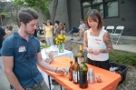 Joey does a little fist pump in front of the wine and beer table. Photo: Garrett Allen