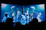 Live feeds from cameras all around the stage are displayed on the screens behind it, catching every band member in their element during the performance. Photo: Logan Sorenson / LMSorenson.net
