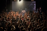 Singer Damien Kulash (rear), stands on the drummers platform, takes a picture of the screaming audience members for Instagram. Photo: Logan Sorenson / LMSorenson.net
