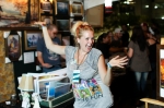 Altered Landscapes draws a crowd as Kat Martin dominates the DIY festival. Her placement of pop cultural icons in tired landscapes gives old paintings new, ironic appeal. Photo: John Barkiple