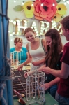The “I can do hard things.” pendant at Charmed Collection put a smile on Heather, Jenna, and Chris’s faces as Leisha smiled in the background. Photo: John Barkiple