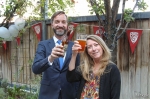 (L–R) Xmission’s Pete Ashdown clinks a glass with Amy Coady. “I remember those must-have Squatters T-shirts as being very cool when I was just out of high school,” he said. Photo: John Barkiple.