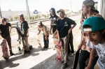 Skaters testing each other by calling out tricks at the second Roughside stop. Photo: Martin S Rivero