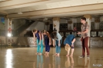 Pair-diddle dancers take a bow while their drummer applauds. Photo by John Barkiple.