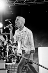 Tyler Glenn singing in to the micophone. Photo: Gilbert Cisneros
