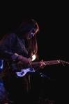 Paloma of The Dove & the Wolf gently strumming her guitar during a set that could be described as longing and lovely. Photo: LmSorenson.net