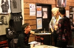 (L-R): Adam Higgins works the Zola Jesus merch table at Urban Lounge and chats with Alex Finch and Roy Wood. He’s explaining how Nika Danilova worked with Seattle’s Blackbird to create a scent for this tour: Taiga (same name as the album). “It’s like your childhood youth, but also earth,” Finch said. “As if you were to lay in the ground and smell….” Photo: John Barkiple