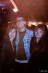 (L-R): SLUG Magazine staffers Robin Sessions, Christian Schultz, and Kia McGinnis gather near the Urban Lounge bar as they listen to Deradoorian. “I heard about the show through SLUG Magazine,” Sessions said. Photo: John Barkiple