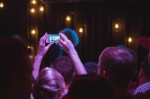 An audience member, deciding to spend their time and admission price holding their phone in the air. Photo: @Lmsorenson