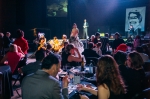 Attendees enjoy food and drink during the live auction. Photo: Tyson Call
